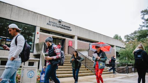 students walking outside of school of business and entrepreneurship